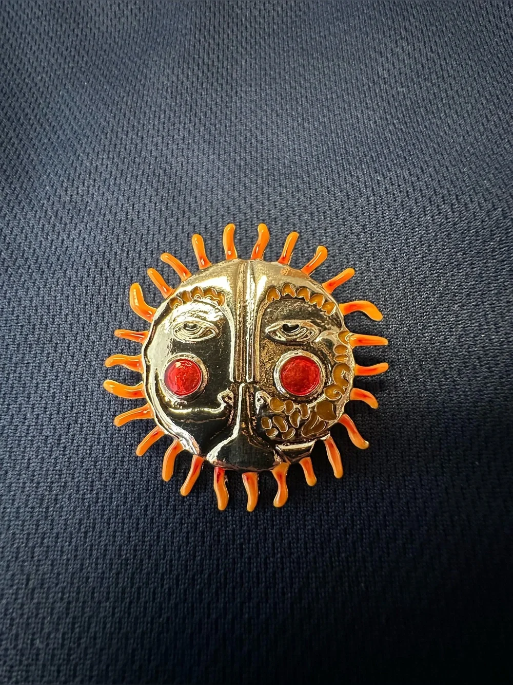 Gold Sun Face Brooch with Orange Rays and Red Accent Eyes